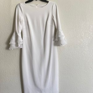Gorgeous white flare sleeve dress. Bridal shower